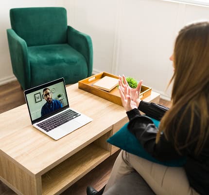 Woman focused on a video counselling session